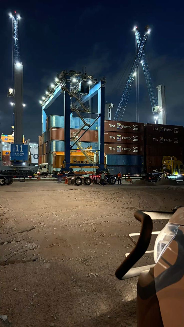 Terminal handling equipment moving containers at night